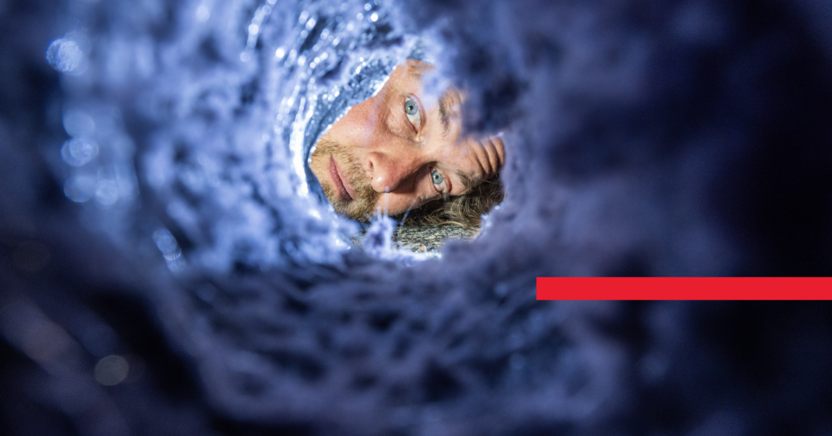 Homeowner Checking To See If Dryer Vent Is Clogged