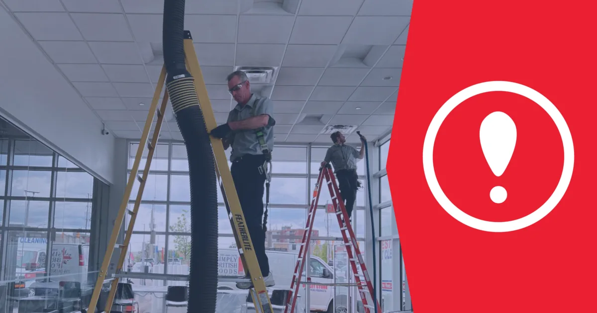Prestige technicians cleaning HVAC system at office building so business can experience the benefits of duct cleaning